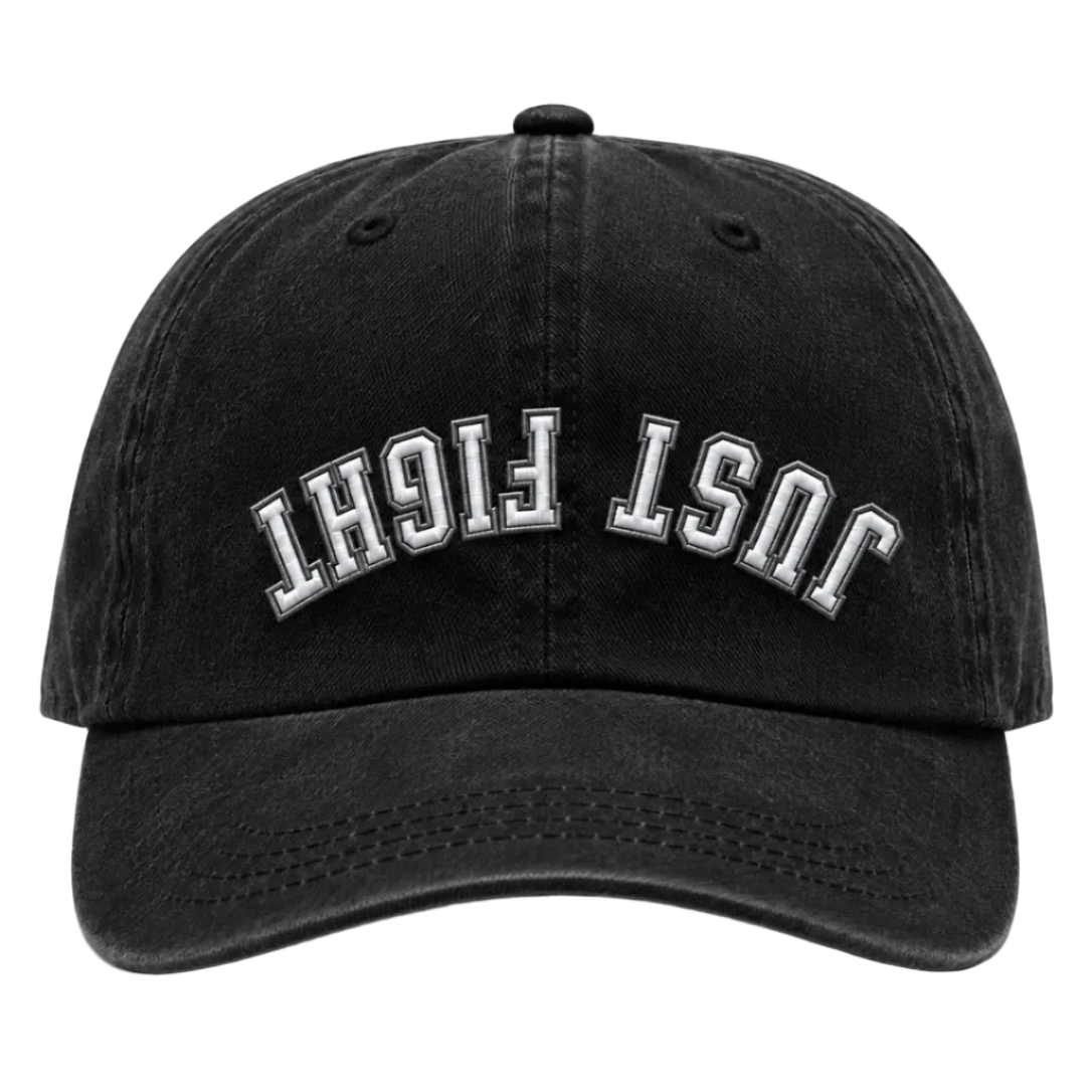 A black washed baseball cap with 'JUST FIGHT' embroidered in white arched block letters on the front, shown against a plain white background.